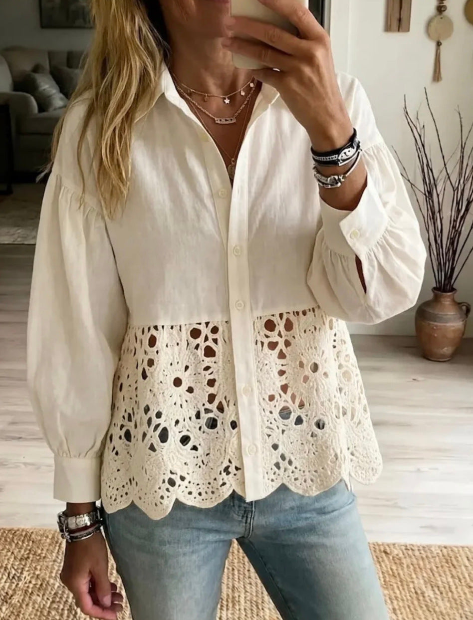 A woman wearing a cream-colored long-sleeve blouse with a solid upper section and an eyelet lace overlay at the waist, paired with light blue jeans.