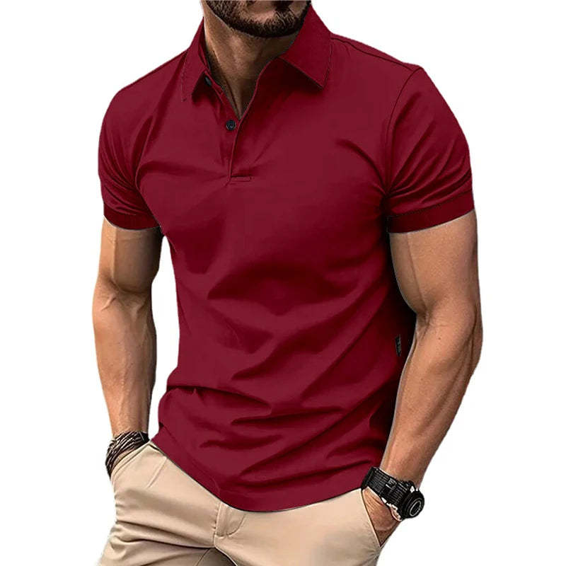 Man wearing a red polo shirt and beige pants on a white background
