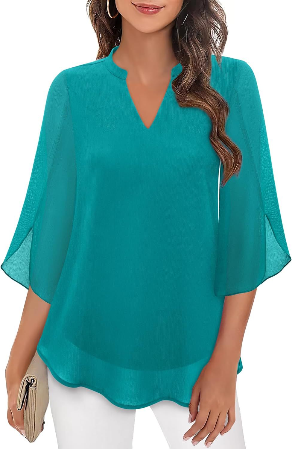 Teal blouse worn by a model on a white background