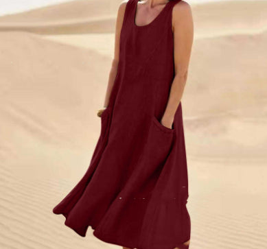 Person wearing a burgundy dress in a desert setting