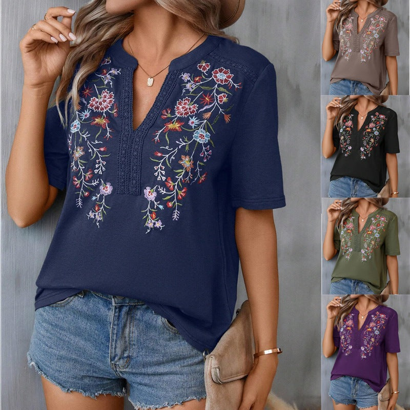 Navy blue embroidered top worn by a model with color options displayed.