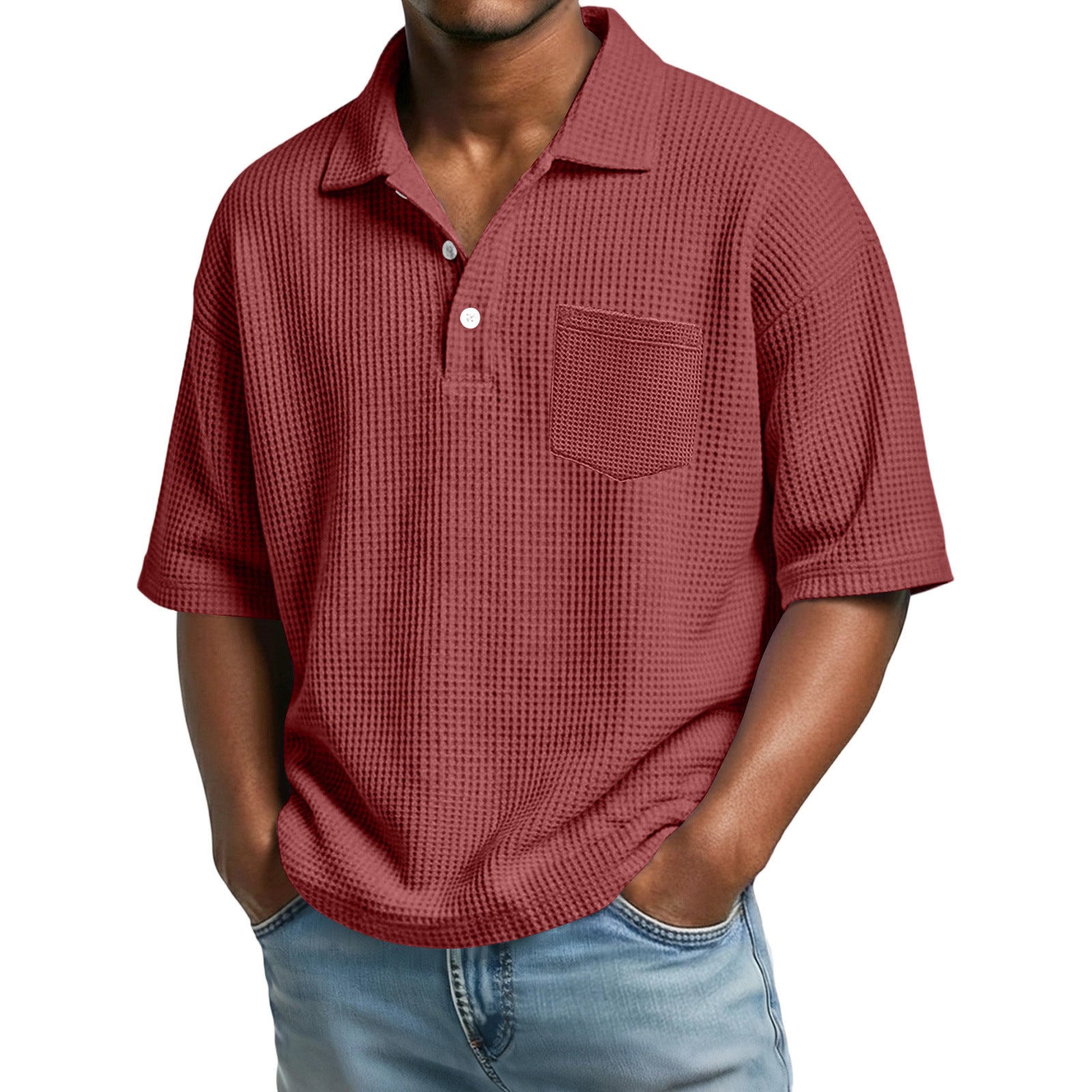 Man wearing a red textured polo shirt with a pocket on a white background