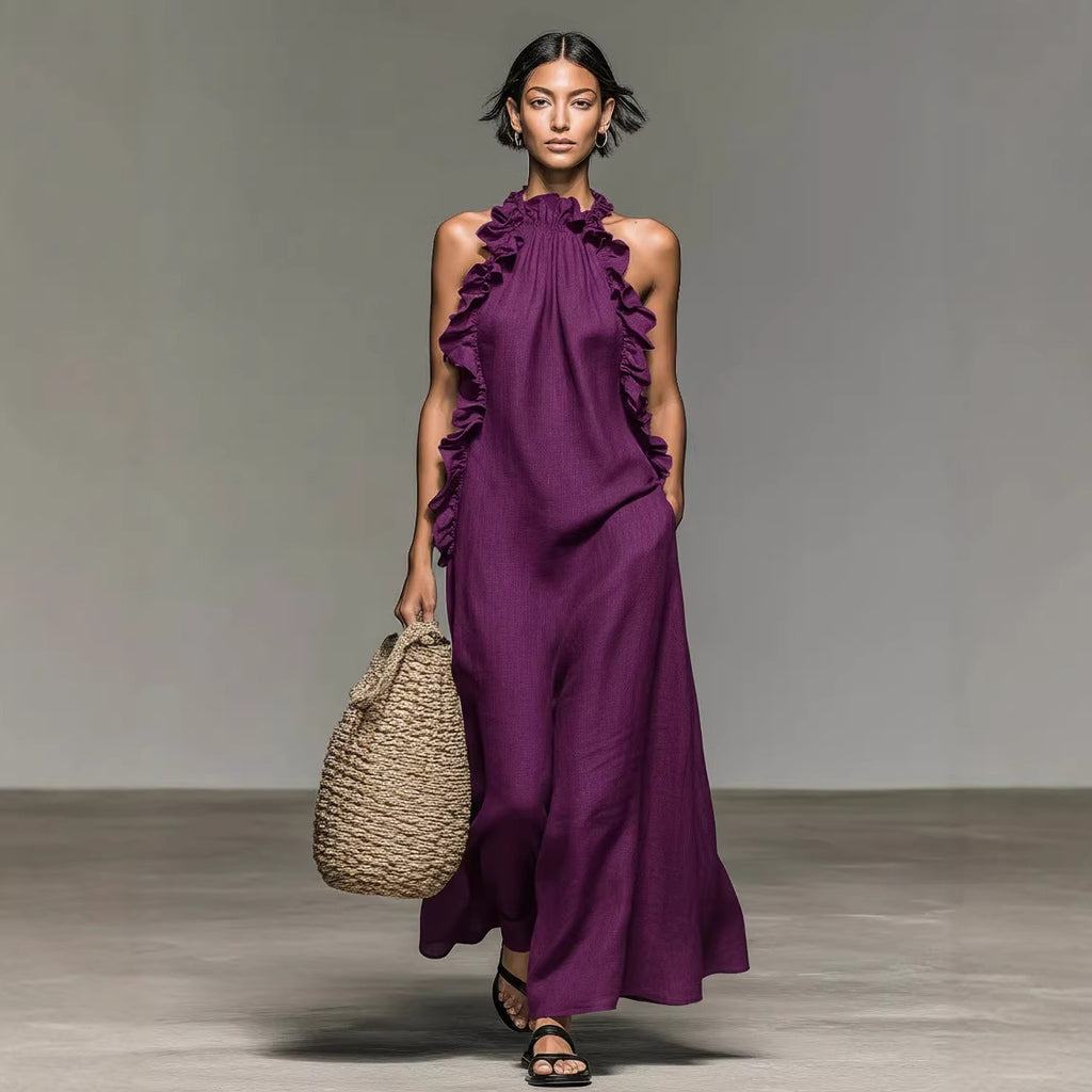 Model wearing a purple dress holding a woven bag on a neutral background