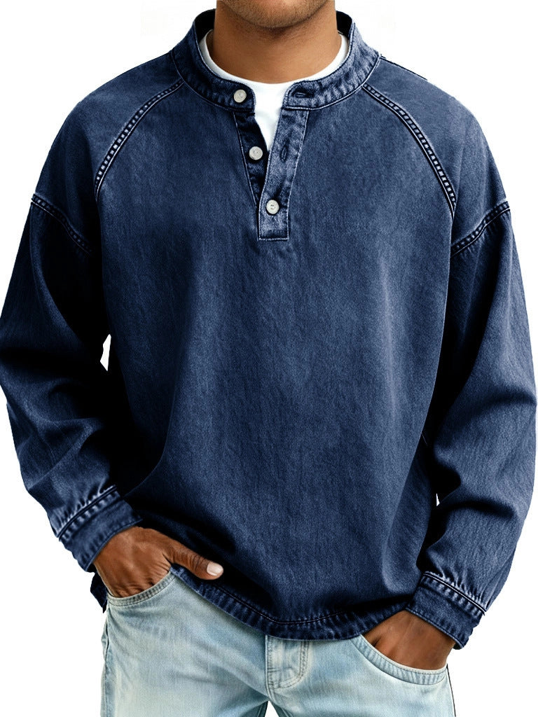 Person wearing a blue denim shirt with a white background