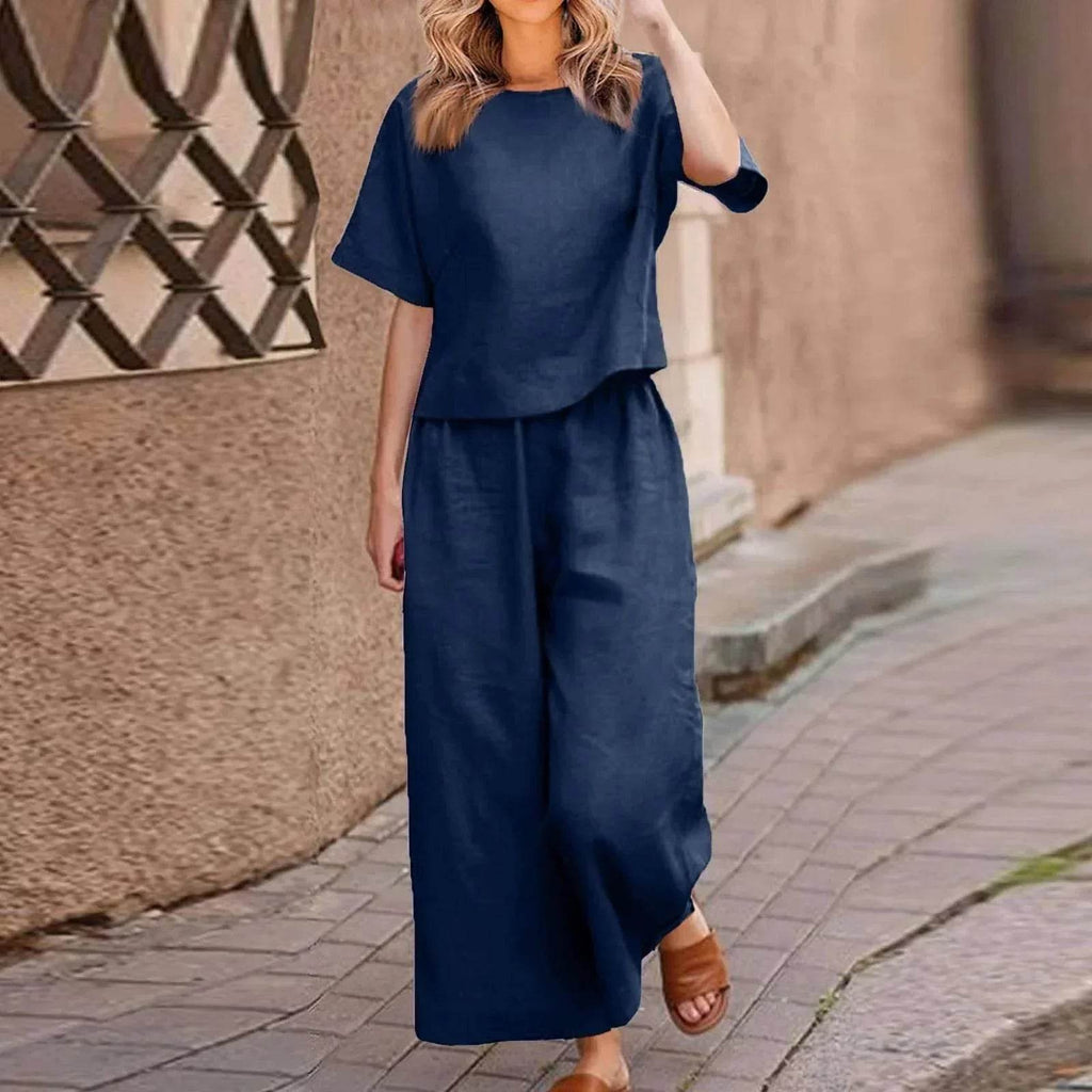 Woman wearing a navy blue matching set with wide-leg pants from ZA-Zola on a city street