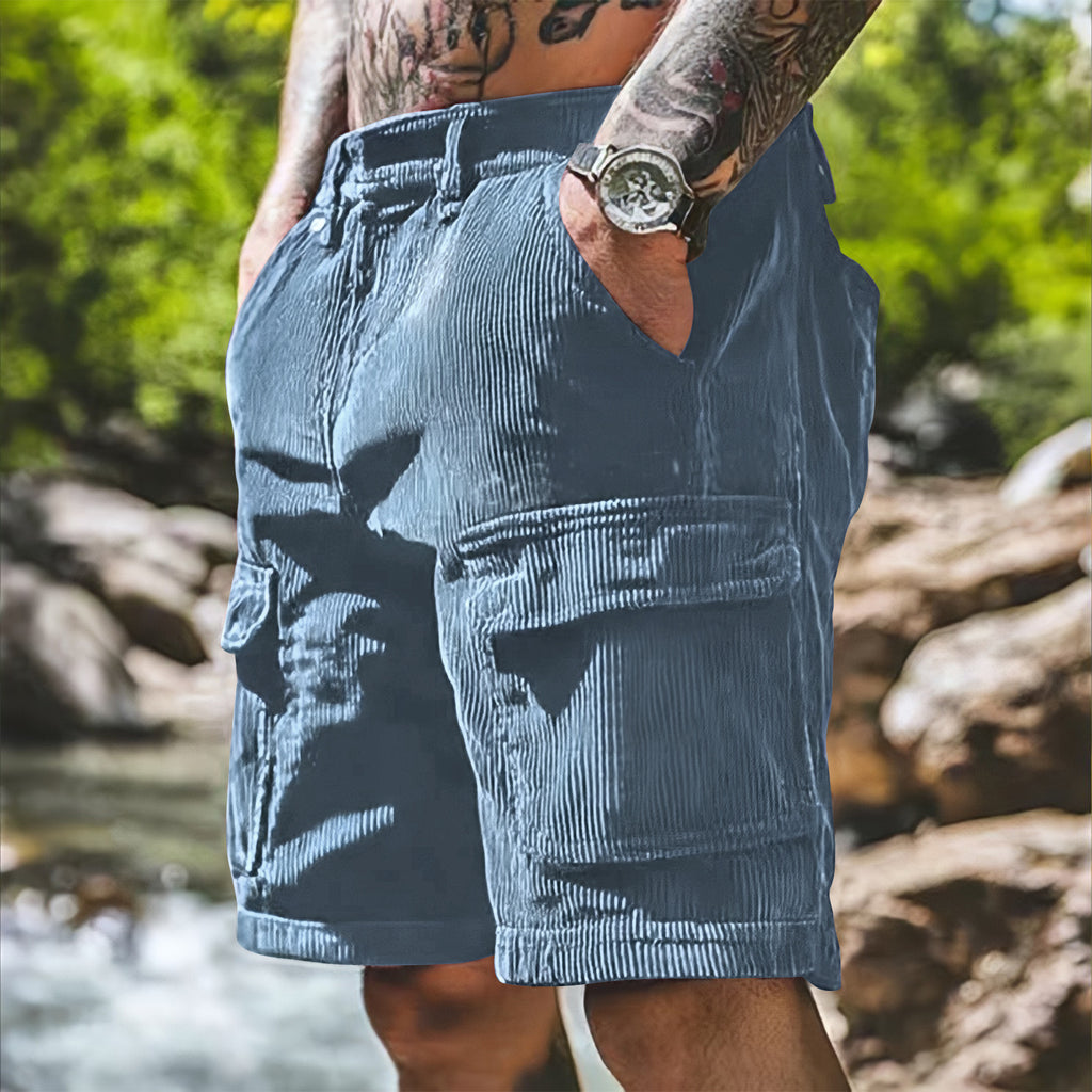 Person wearing blue shorts with a natural background
