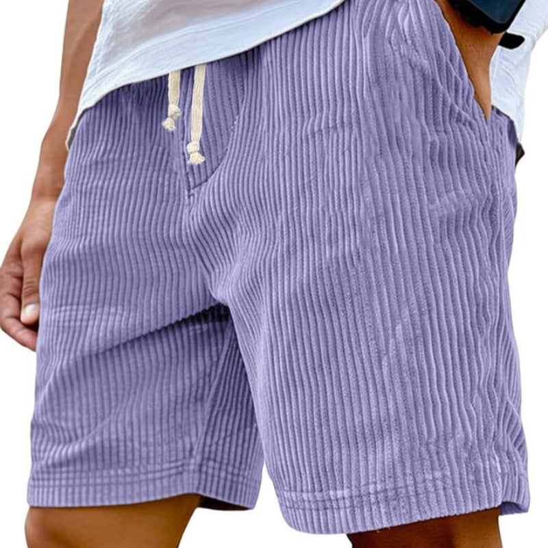 Purple corduroy shorts worn by a person, with a focus on the fabric texture.
