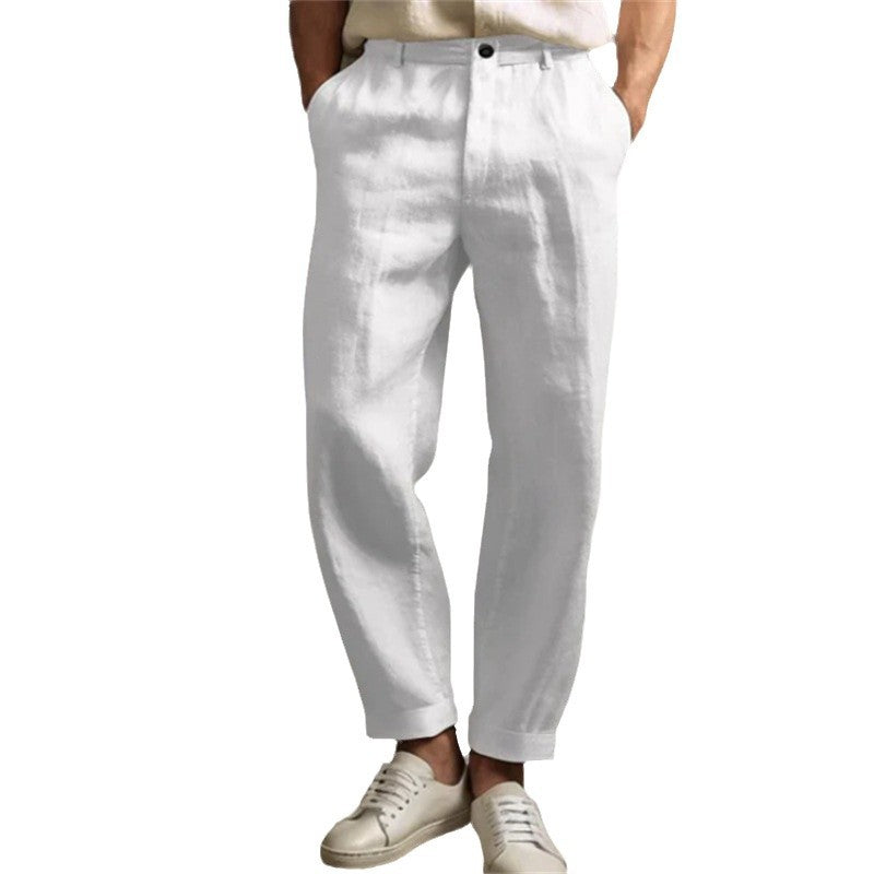 White pants worn by a person on a white background
