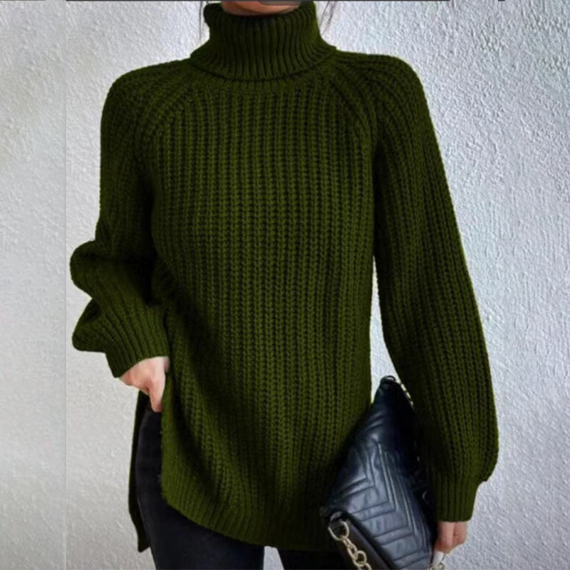 Person wearing a green knitted sweater against a plain background