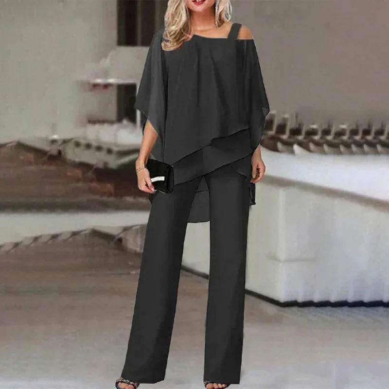 Woman wearing a trendy black layered pantsuit from ZA-Zola, stylish fashion apparel UK