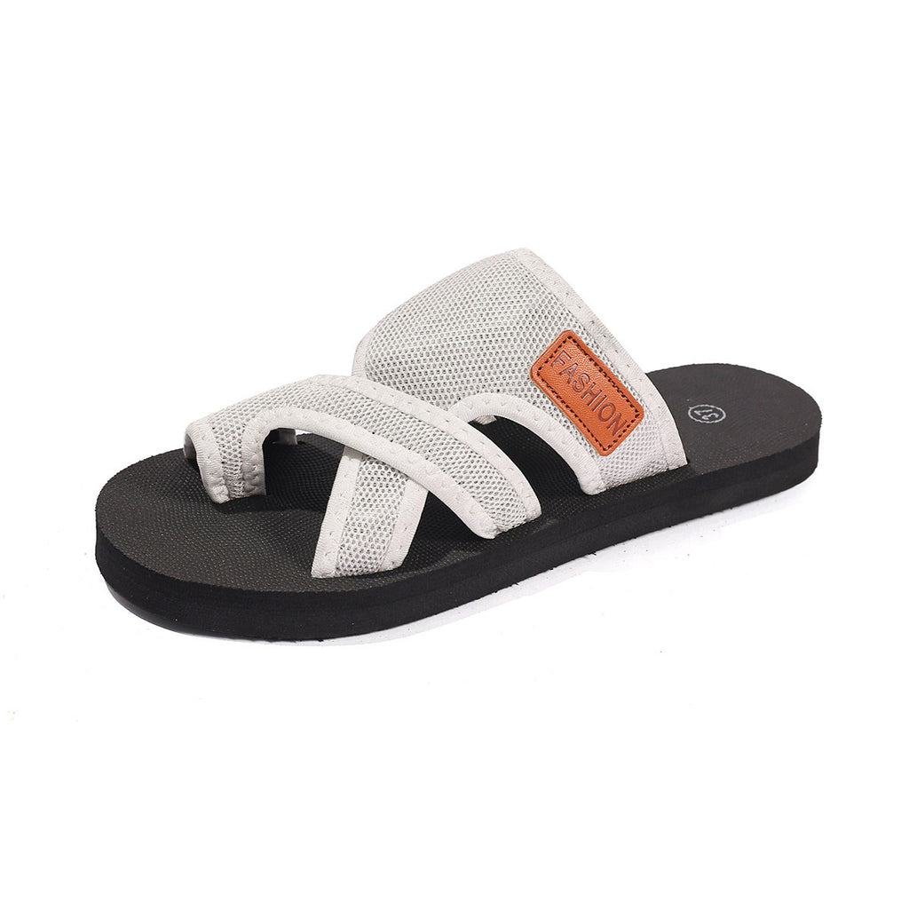 White sandal with black sole on a white background
