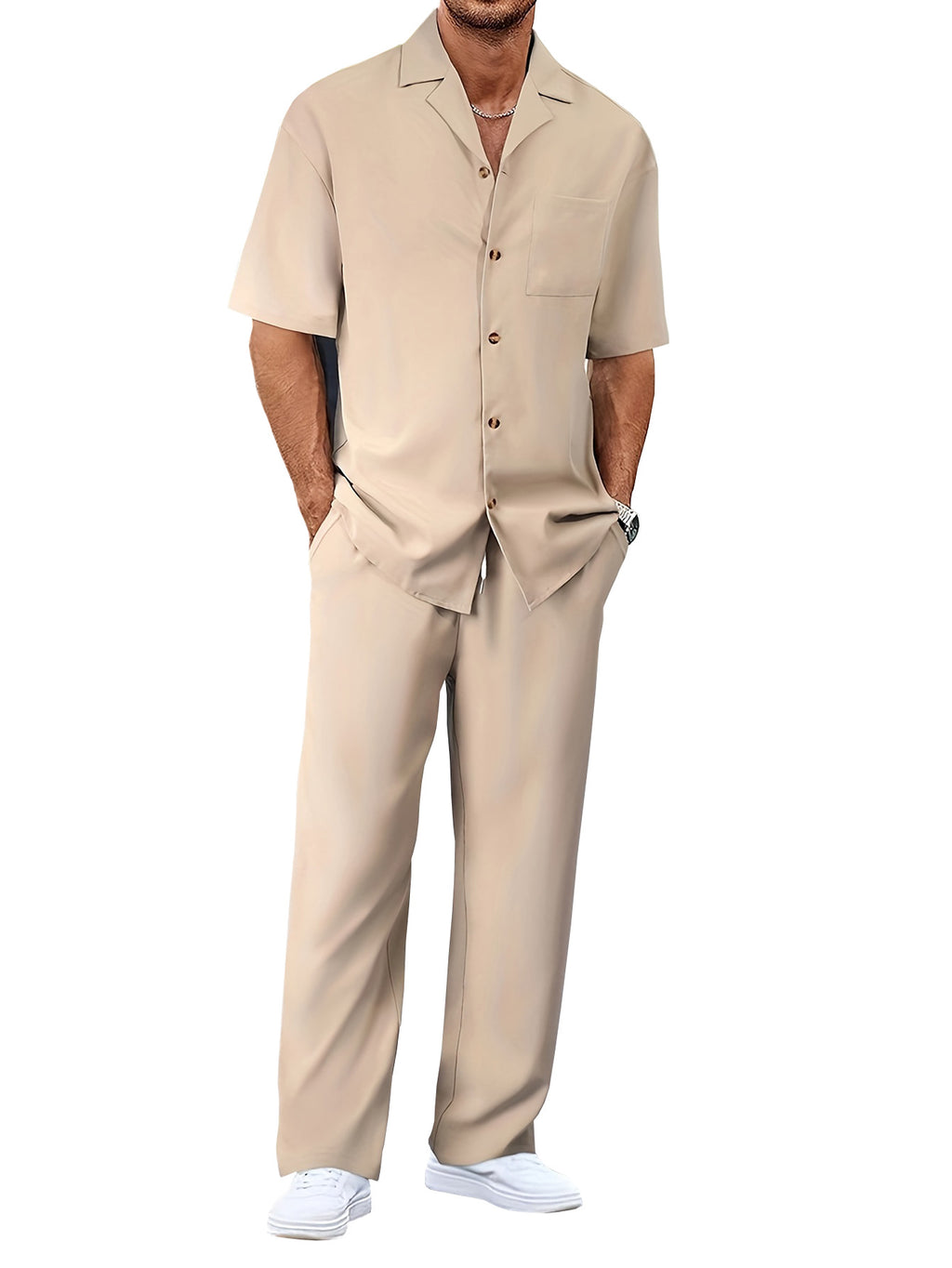 Man wearing a beige shirt and pants set on a white background