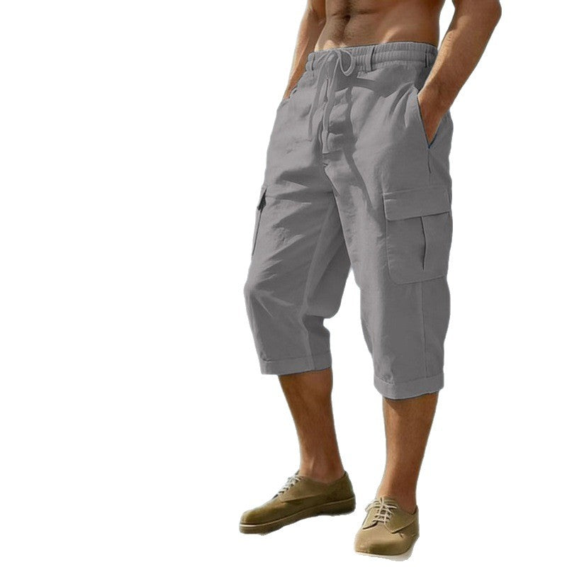 Gray cargo shorts worn by a person on a white background