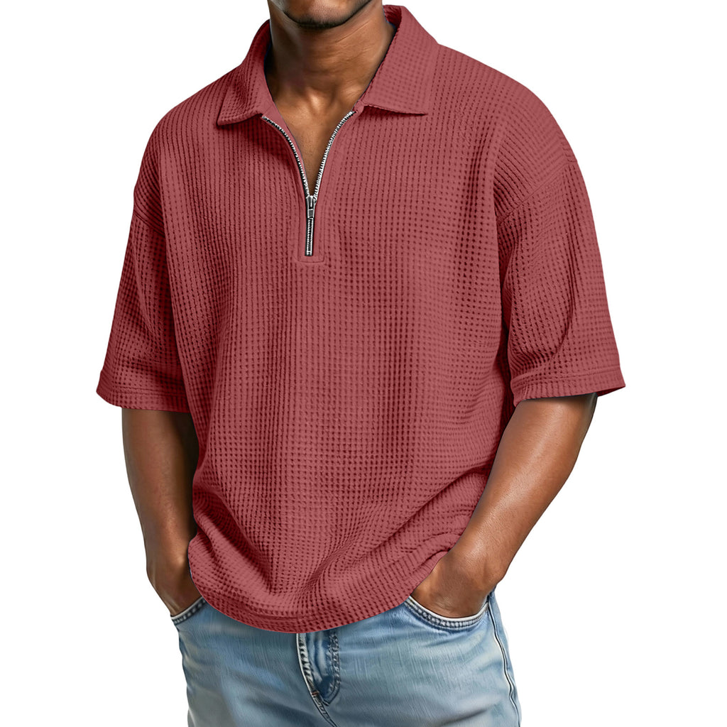 Man wearing a red textured shirt with a zipper on a white background