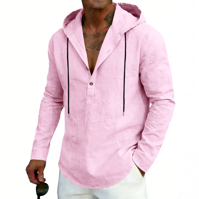 Man wearing a light pink hoodie with black accents on a white background