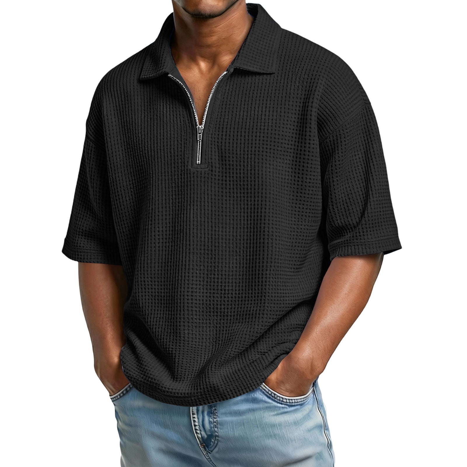 Man wearing a black short-sleeve zip-up shirt with a white background