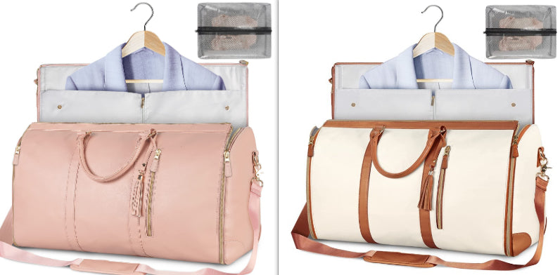 Pink and beige travel bags with hangers and clothes on a white background