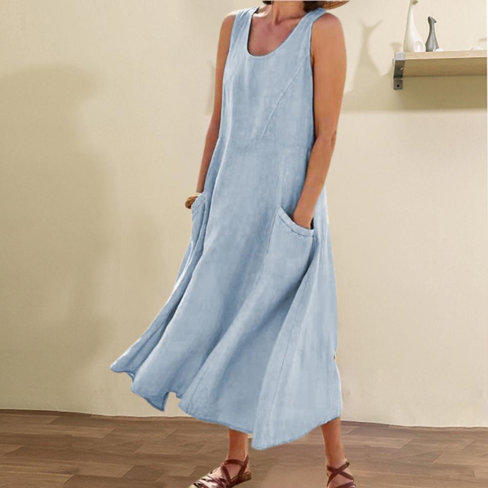 Light blue sleeveless dress worn by a person against a plain background