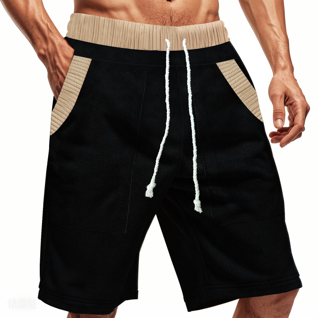 Black shorts with beige drawstring and waistband on a white background