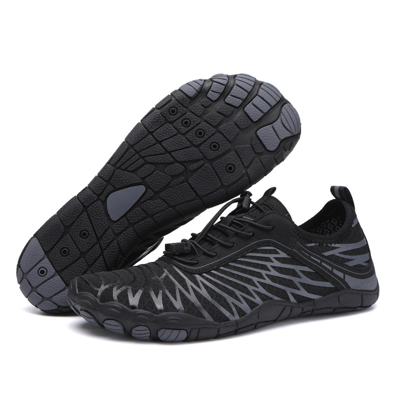 Black and gray athletic shoes on a white background