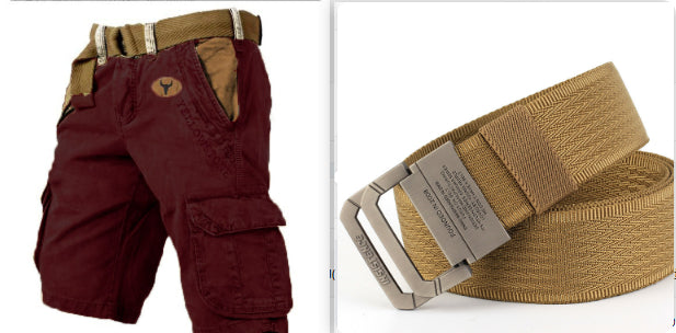 A split image showing two products: on the left, maroon cargo shorts with a tan belt and a small circular logo patch; on the right, a tan woven belt with a silver buckle. The shorts have a tan logo patch on the left hip.