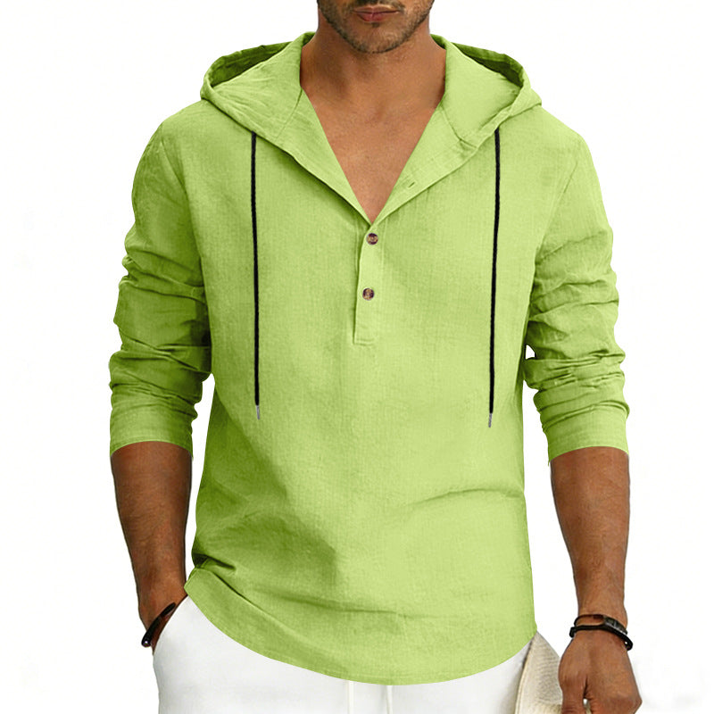 Green hoodie worn by a person on a white background