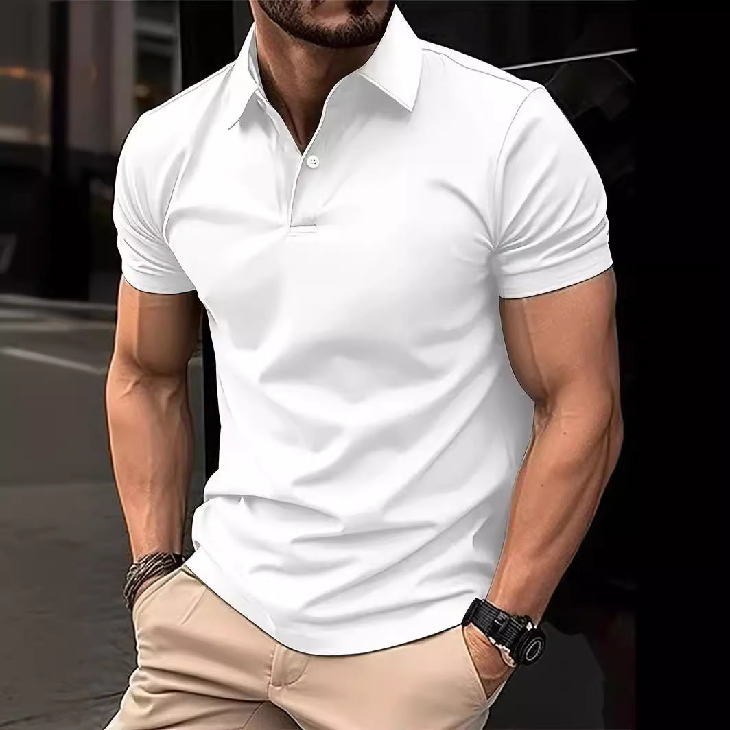 Man wearing a white polo shirt and beige pants with a blurred background