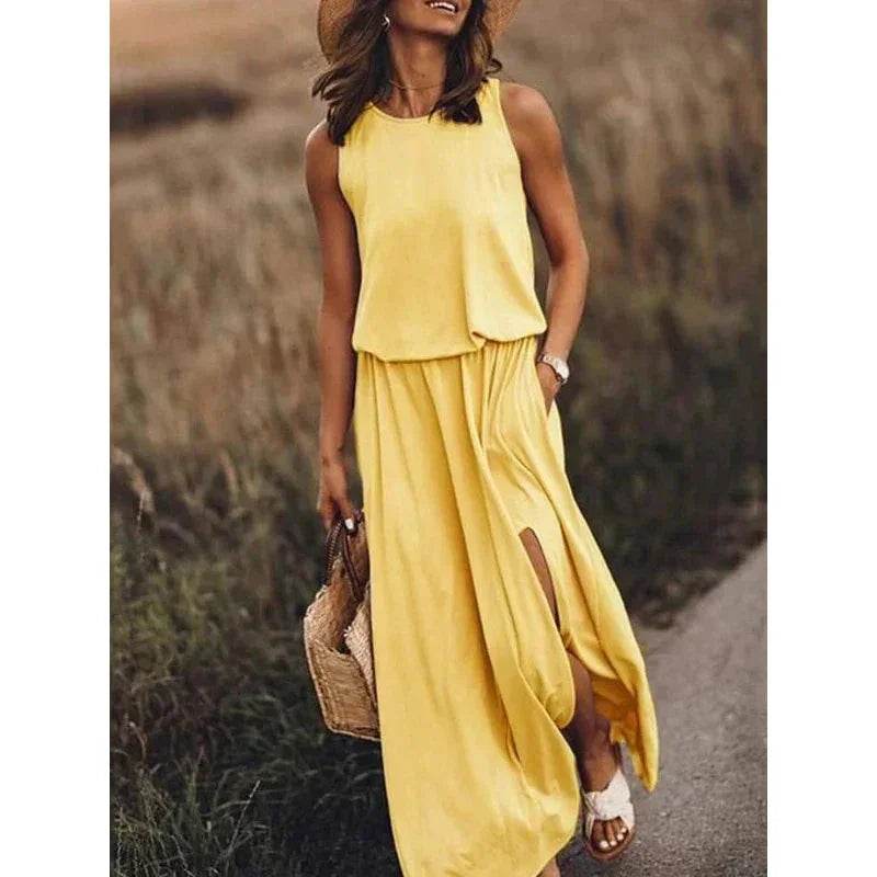 Woman in yellow sleeveless maxi dress, straw hat and sandals, stylish summer fashion ZA-Zola
