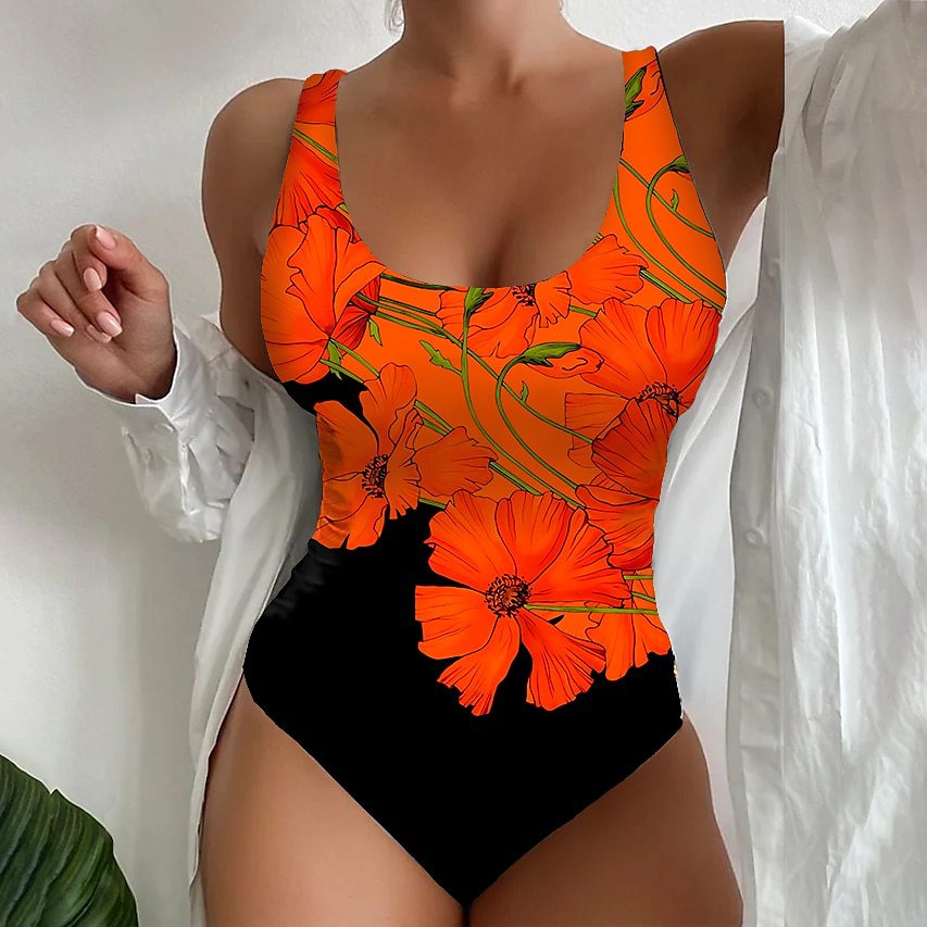 Orange floral swimsuit with black bottom on a white background