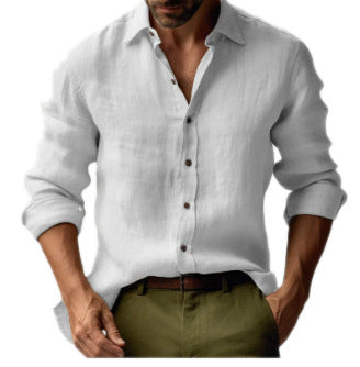 Man wearing a light gray linen shirt with rolled-up sleeves and green pants on a white background