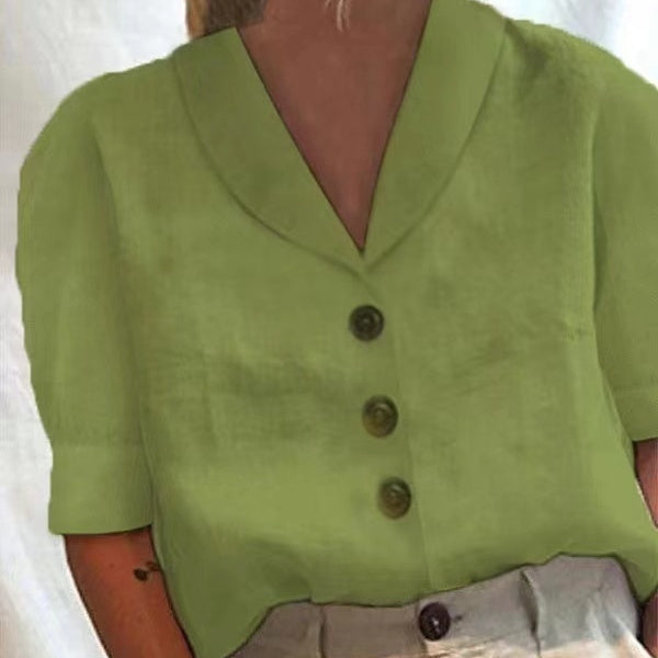 Green button-up shirt worn by a person on a white background