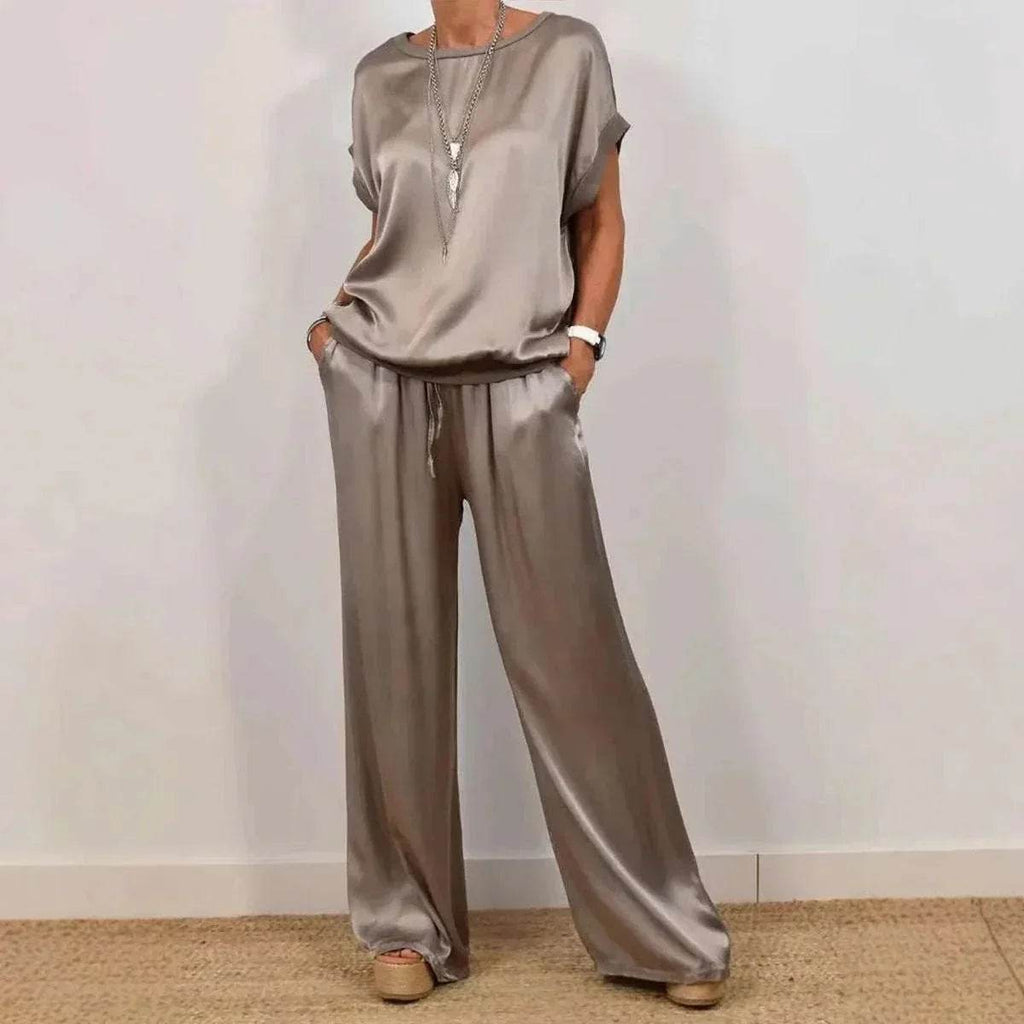Woman wearing a satin beige lounge set with wide-leg pants from ZA-Zola fashion UK