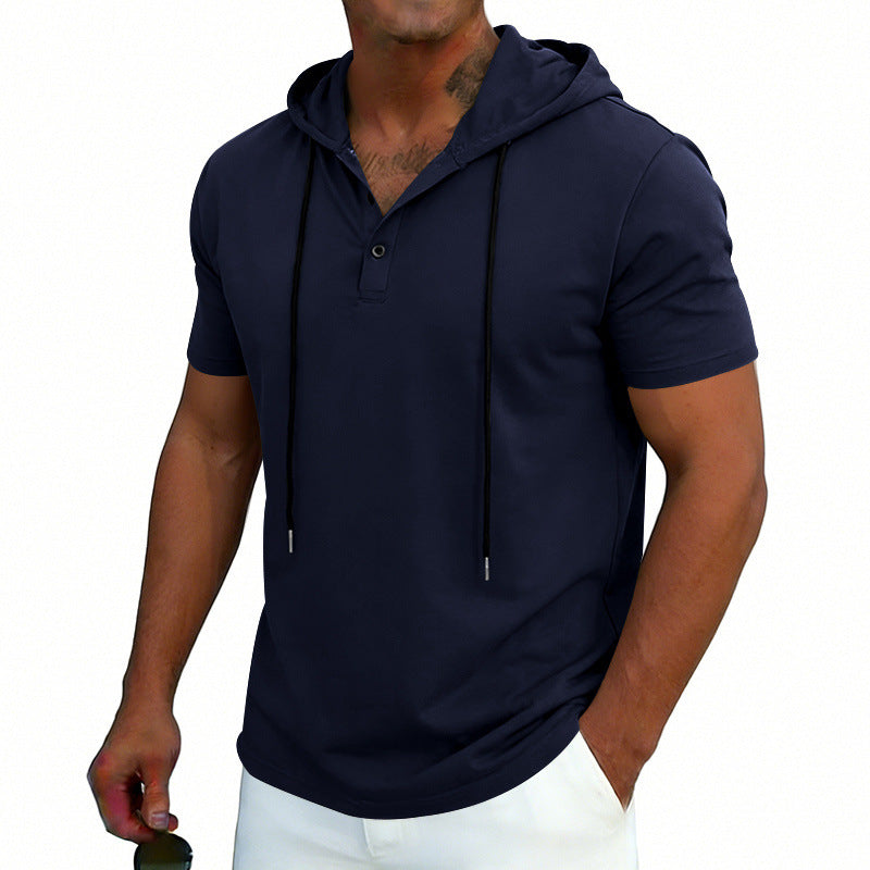 Man wearing a navy blue short-sleeve hoodie on a white background
