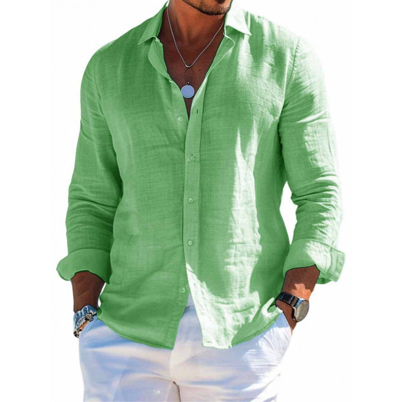Green linen shirt worn by a person on a white background