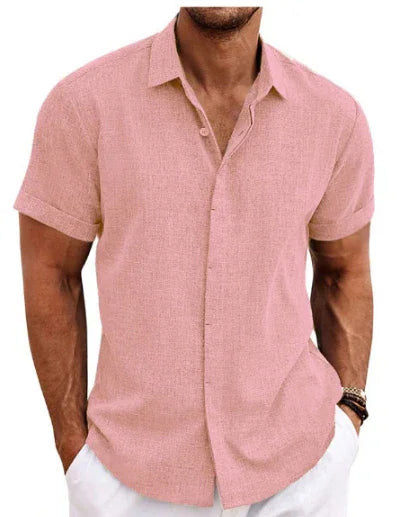 Man wearing a pink short-sleeve shirt on a white background