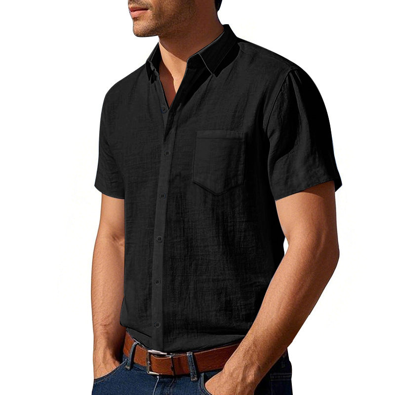 Man wearing a black short-sleeve shirt on a white background