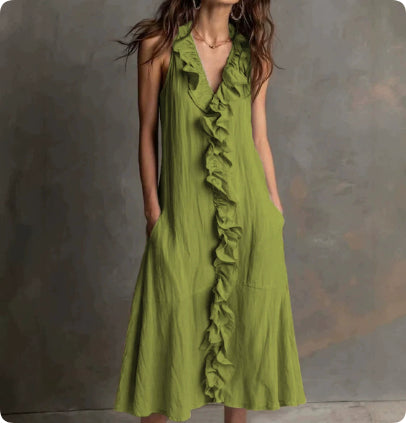 Green ruffled dress on a model against a gray background