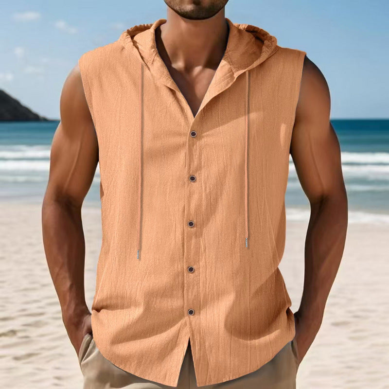 Man wearing a tan sleeveless hoodie on a beach