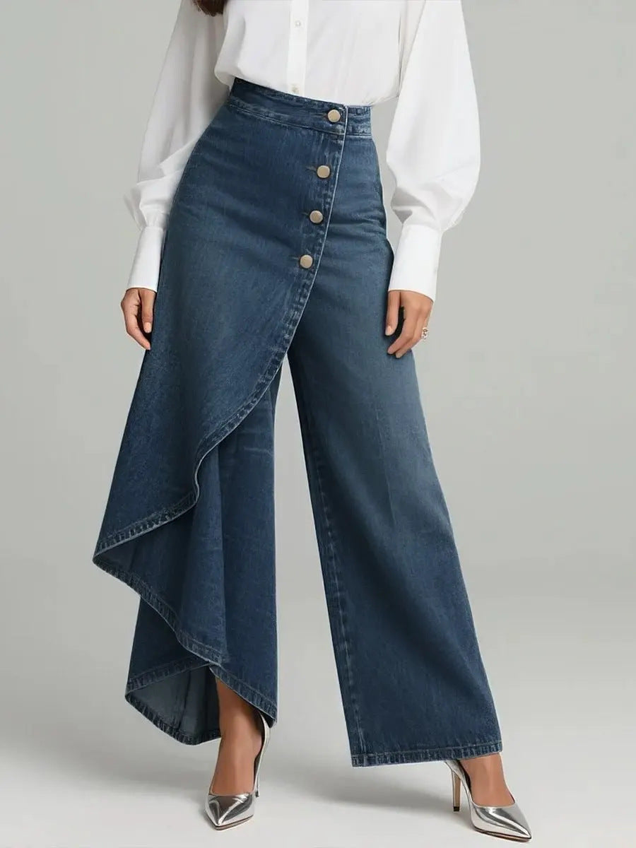 Person wearing a white blouse and blue denim skirt with a button detail on a gray background
