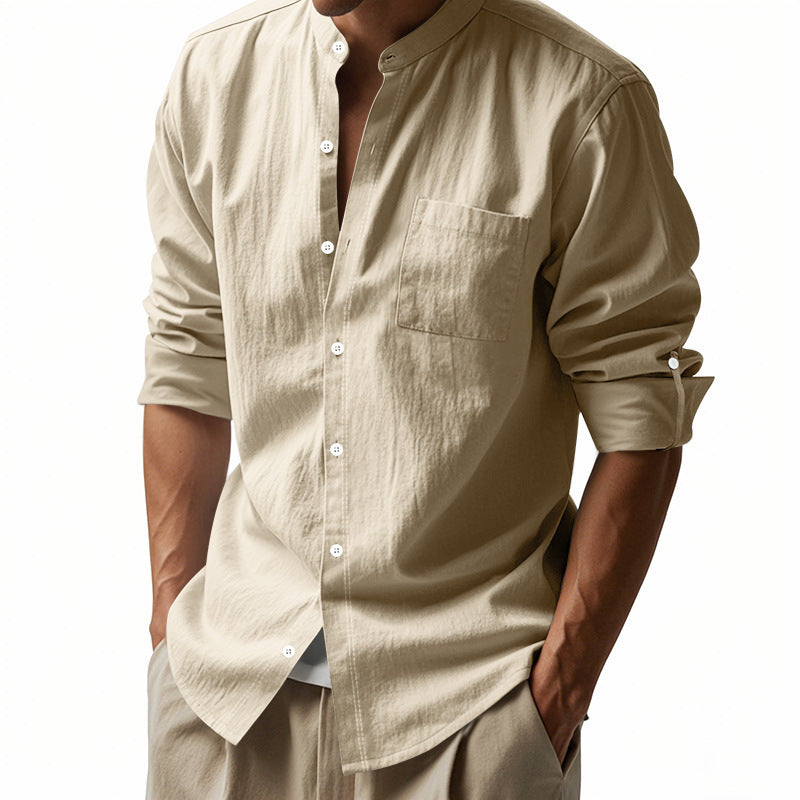 Beige button-up shirt worn by a person on a white background