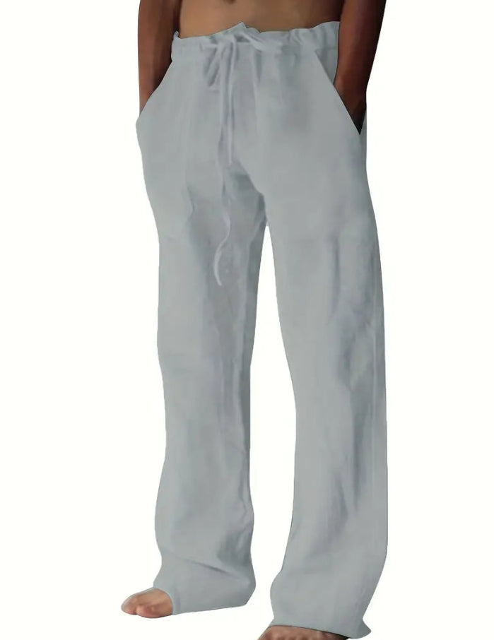 Light gray pants worn by a person on a white background