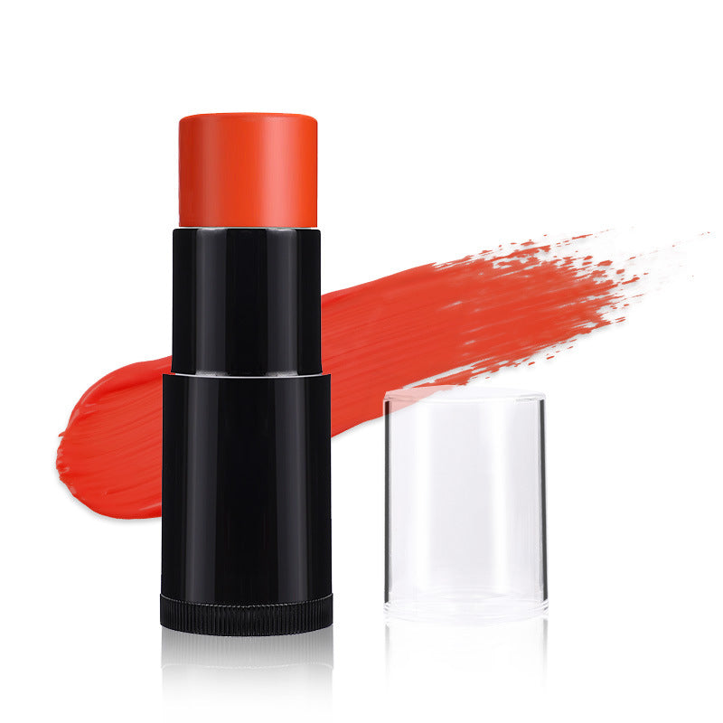 Black lipstick stick with red color on a white background