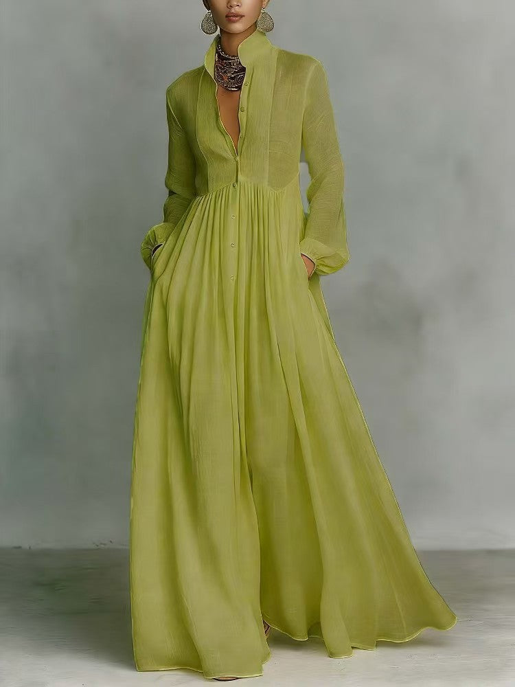 Green dress with long sleeves on a gray background