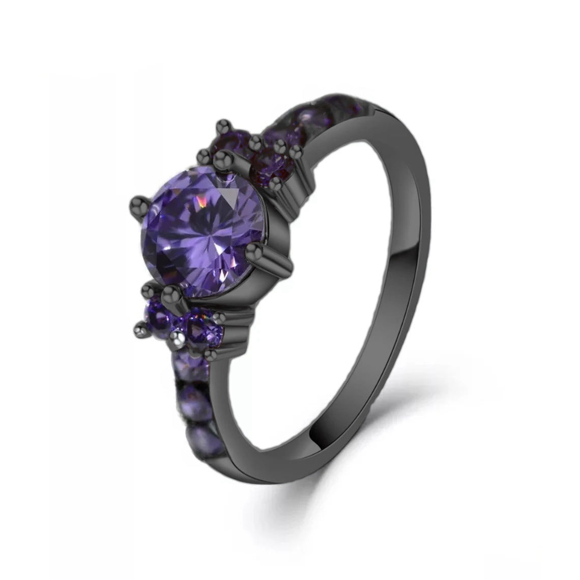Black ring with purple gemstones on a white background