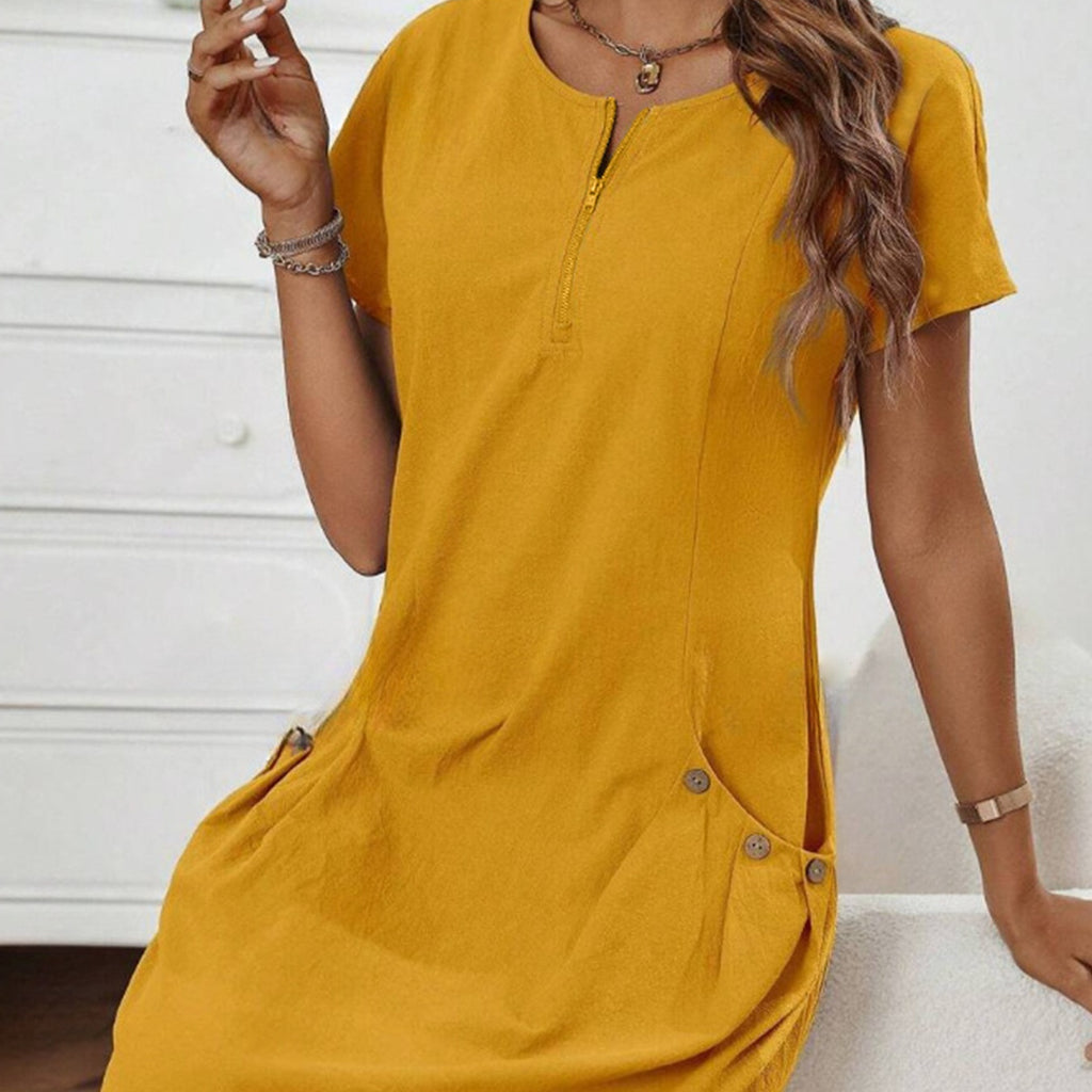 Yellow dress worn by a person with a neutral background