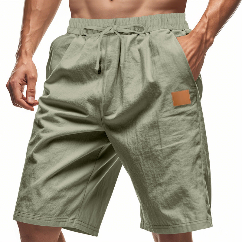 Green shorts with a brown patch on a white background