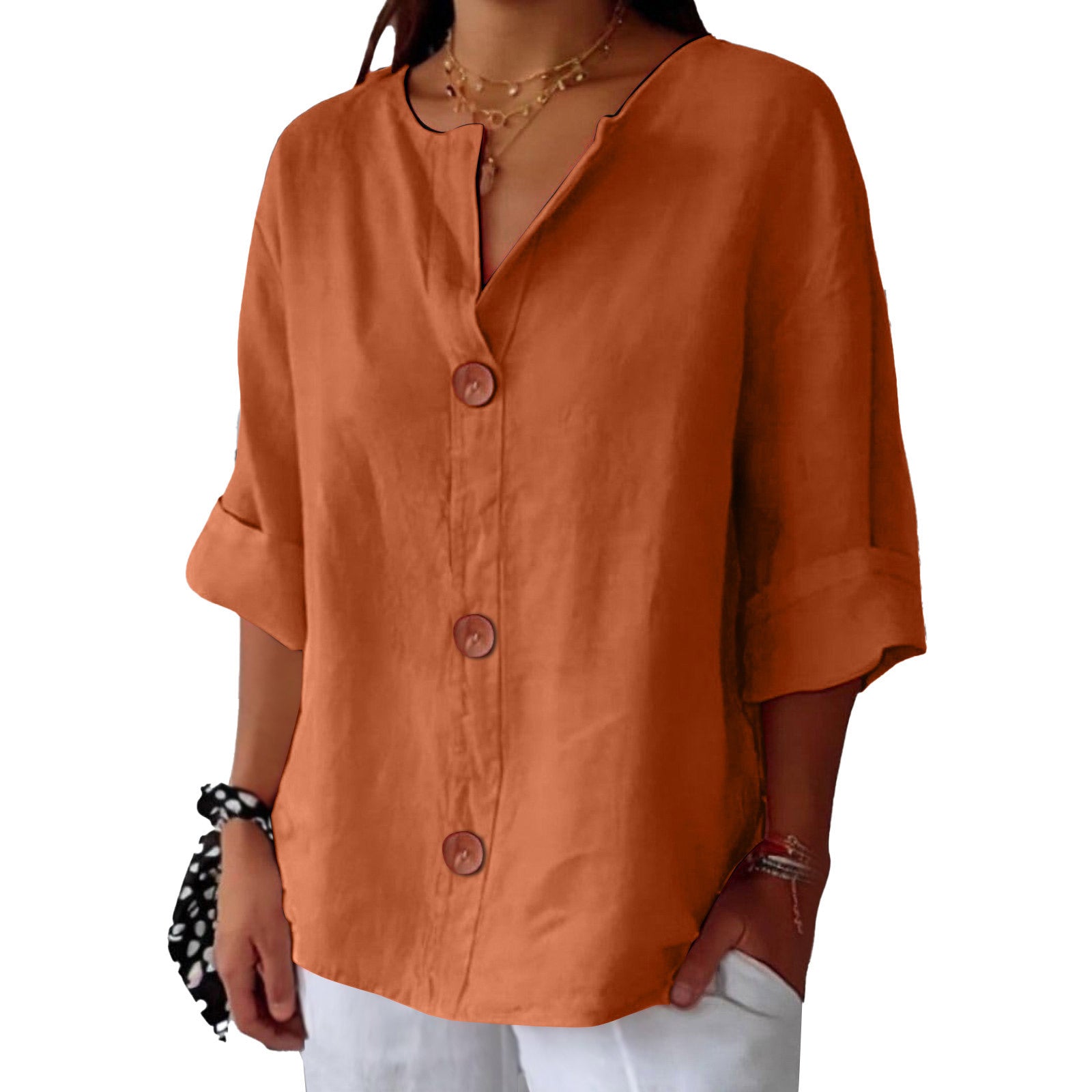 Orange button-up shirt worn by a person on a white background