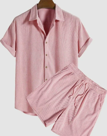 Pink pajama set on a white background