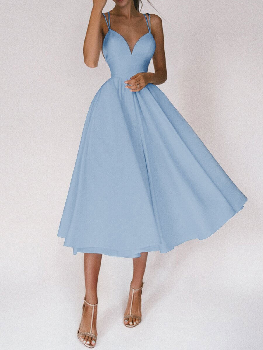 Light blue dress worn by a person on a white background