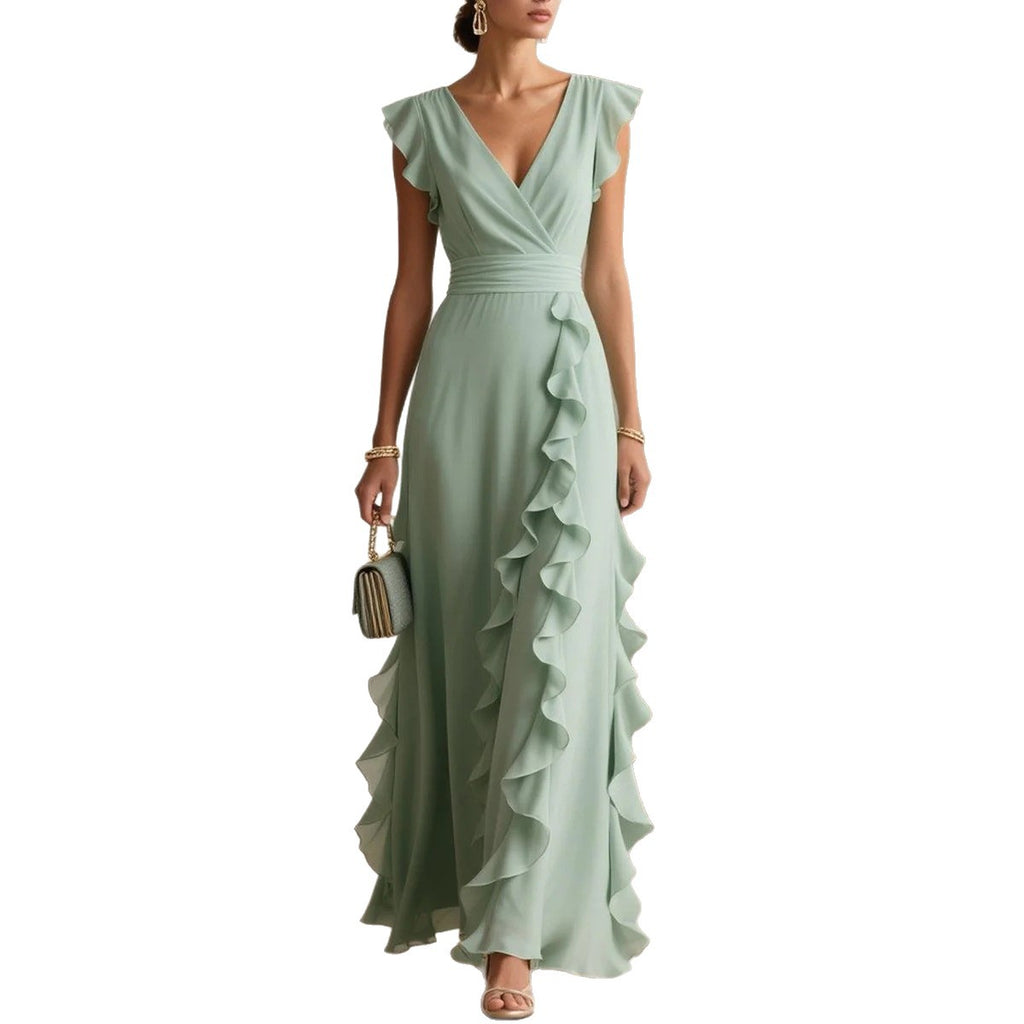 Woman wearing a light green dress with ruffled details on a white background